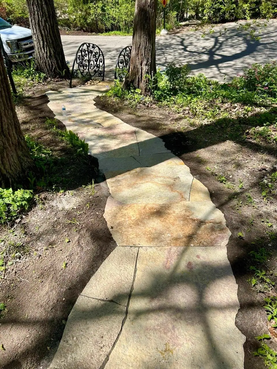 Curving flagstone walkway through a front yard