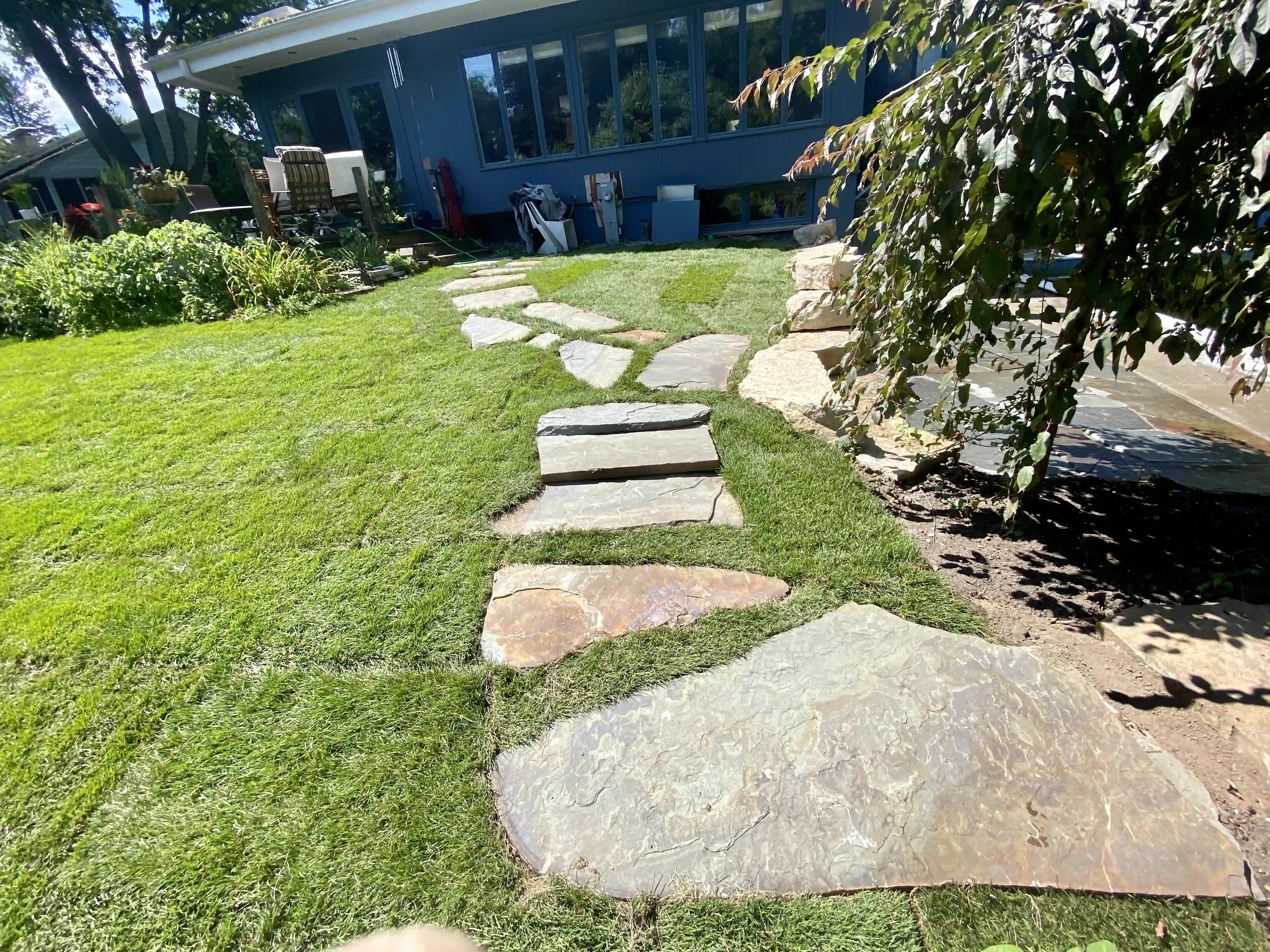 Stepping stones set into freshly laid sod